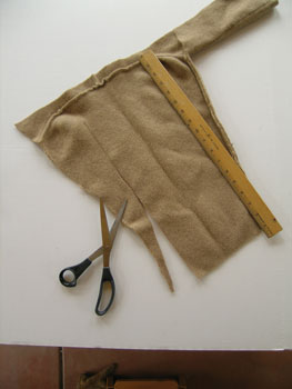 You should be able to get a large rectangle from the front and the back, 12 inches wide by as much as 18 inches long. The sleeves will yield a smaller rectangle.